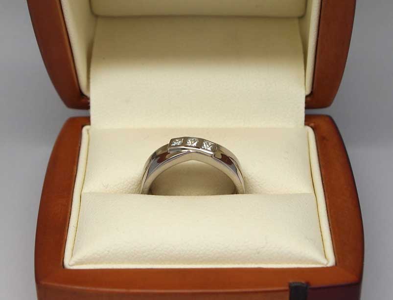 Beautiful palladium bezel set three stone engagement ring