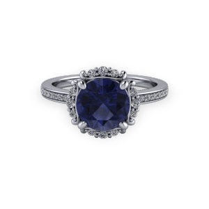 Vintage white gold sapphire and diamond bespoke halo engagement ring