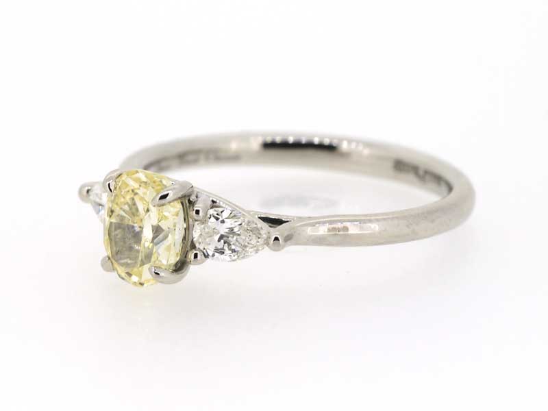 Three stone yellow diamond ring