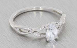 Organic Oval diamond crossover engagement ring - Portfolio