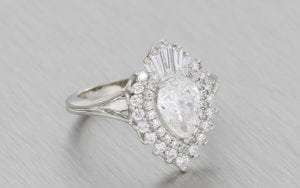 A magnificent pear shaped ballerina ring with a tantalizing mix of round and baguette cut diamonds.