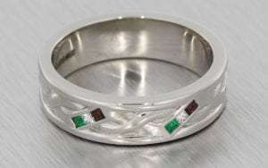 A Twisted Gents Band In Palladium Set With Square Cut Garnets, Emeralds And Diamonds