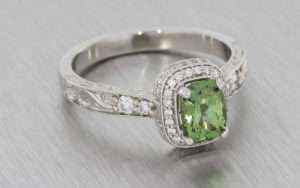 Platinum, green sapphire and diamond ring