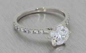 Classic platinum and diamond engagement ring with a personal twist