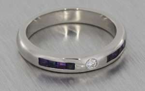 His & hers palladium wedding bands set with diamonds, sapphires and amethysts