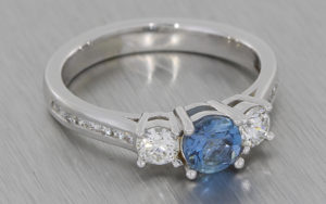 18k White Gold trilogy ring set with aquamarine and white diamonds